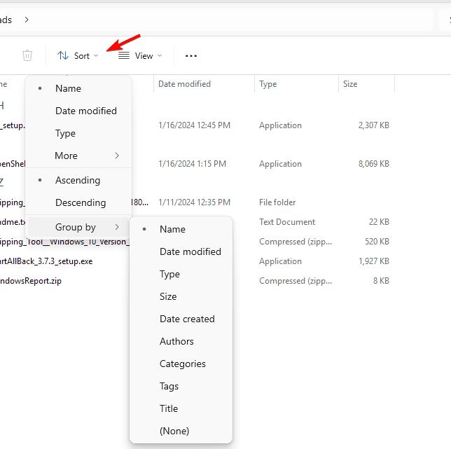 Панель инструментов Проводника с меню «Сортировать по» и опцией «Группировать по»