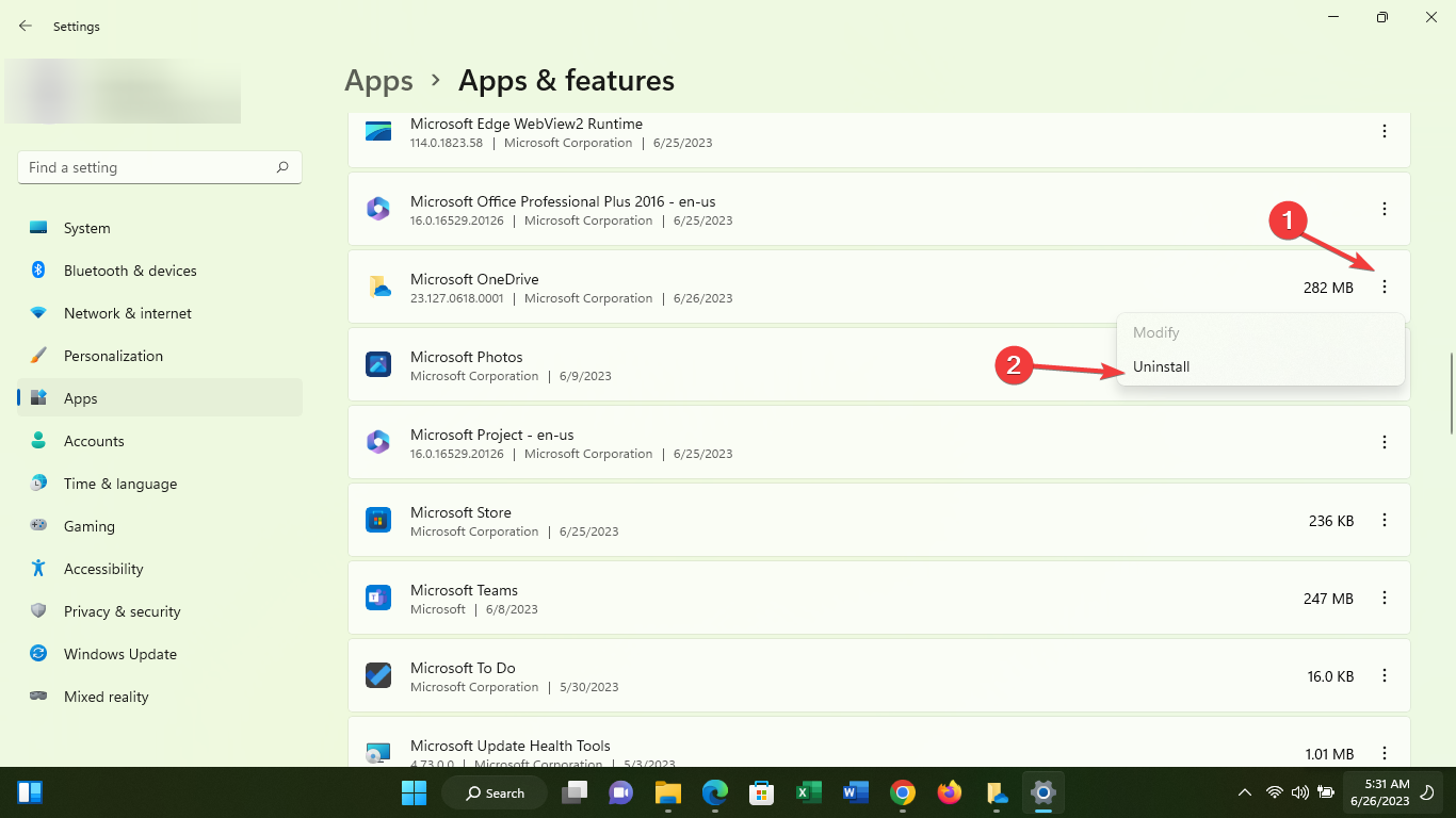 Список приложения OneDrive и кнопка «Удалить»