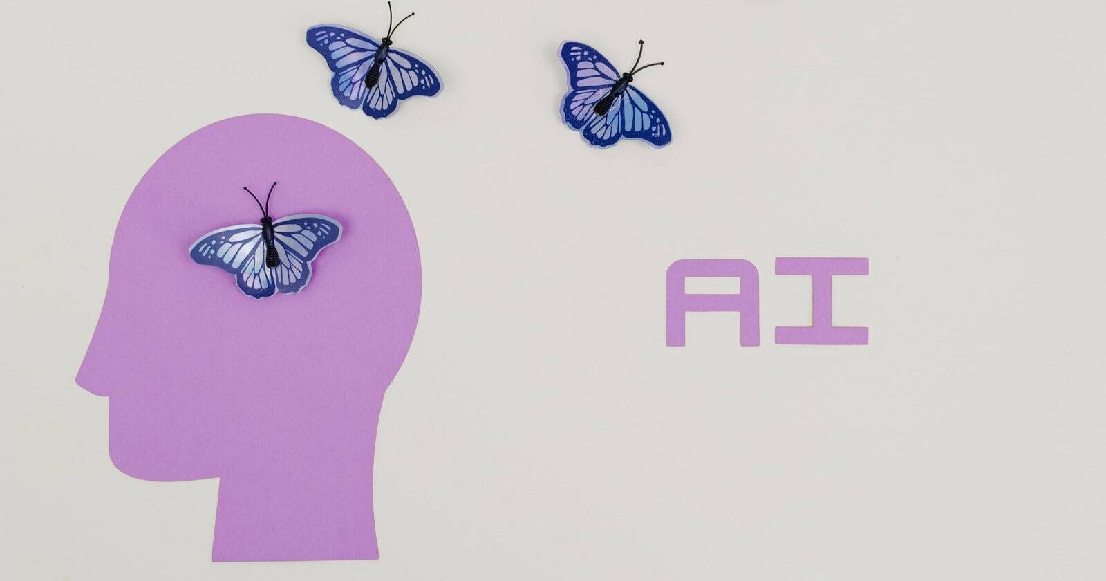Профиль головы с тремя бабочками в виде символов ИИ, улетающими из головы; справа надпись «AI»