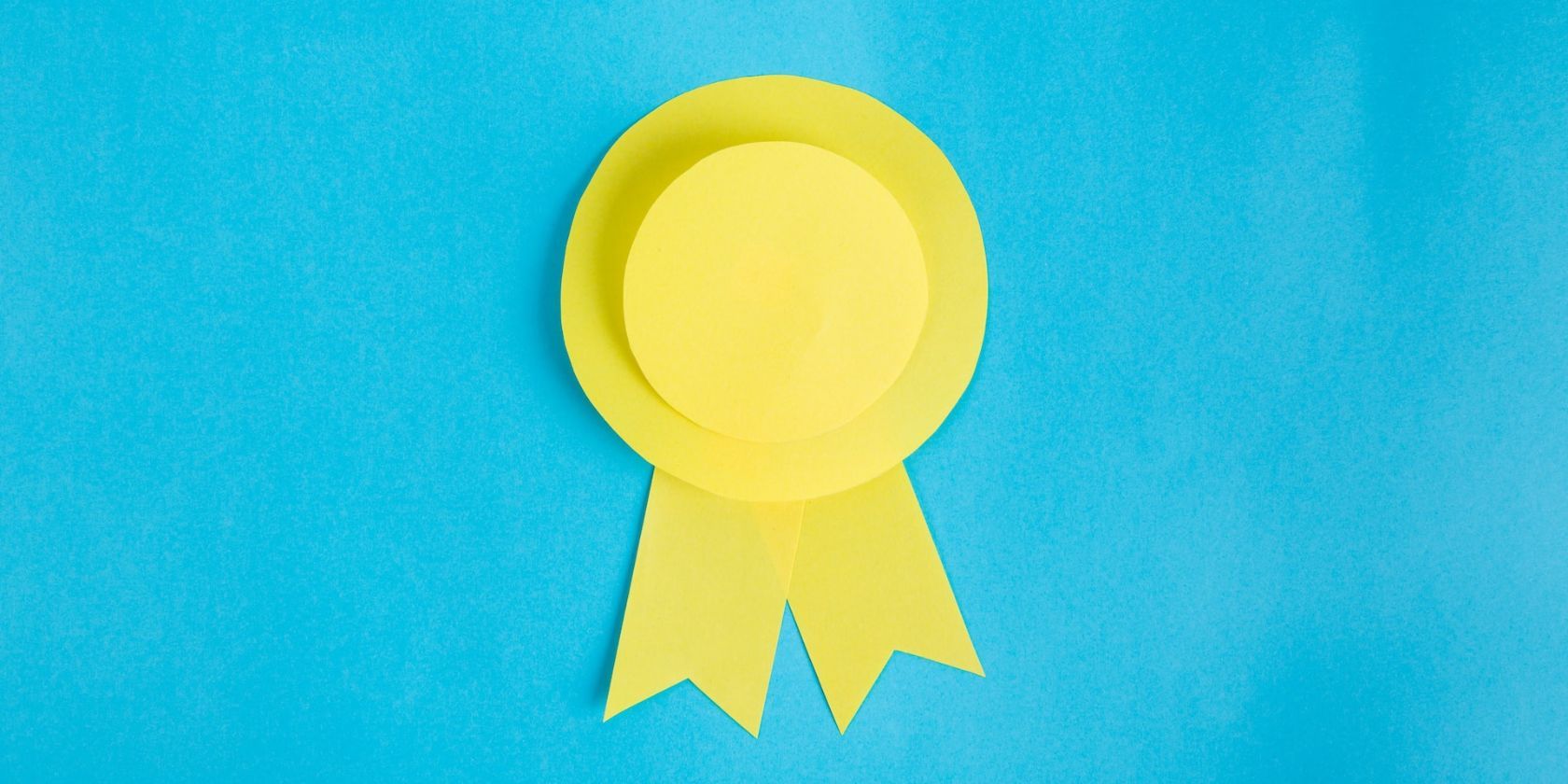 a yellow achievement badge