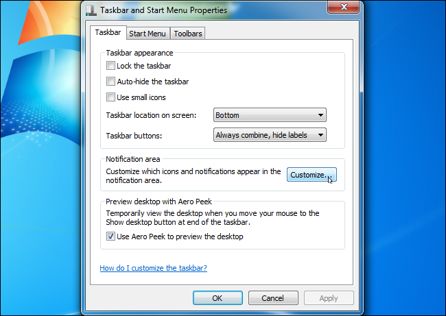 Окно Свойства панели задач с кнопкой Настроить значки области уведомлений