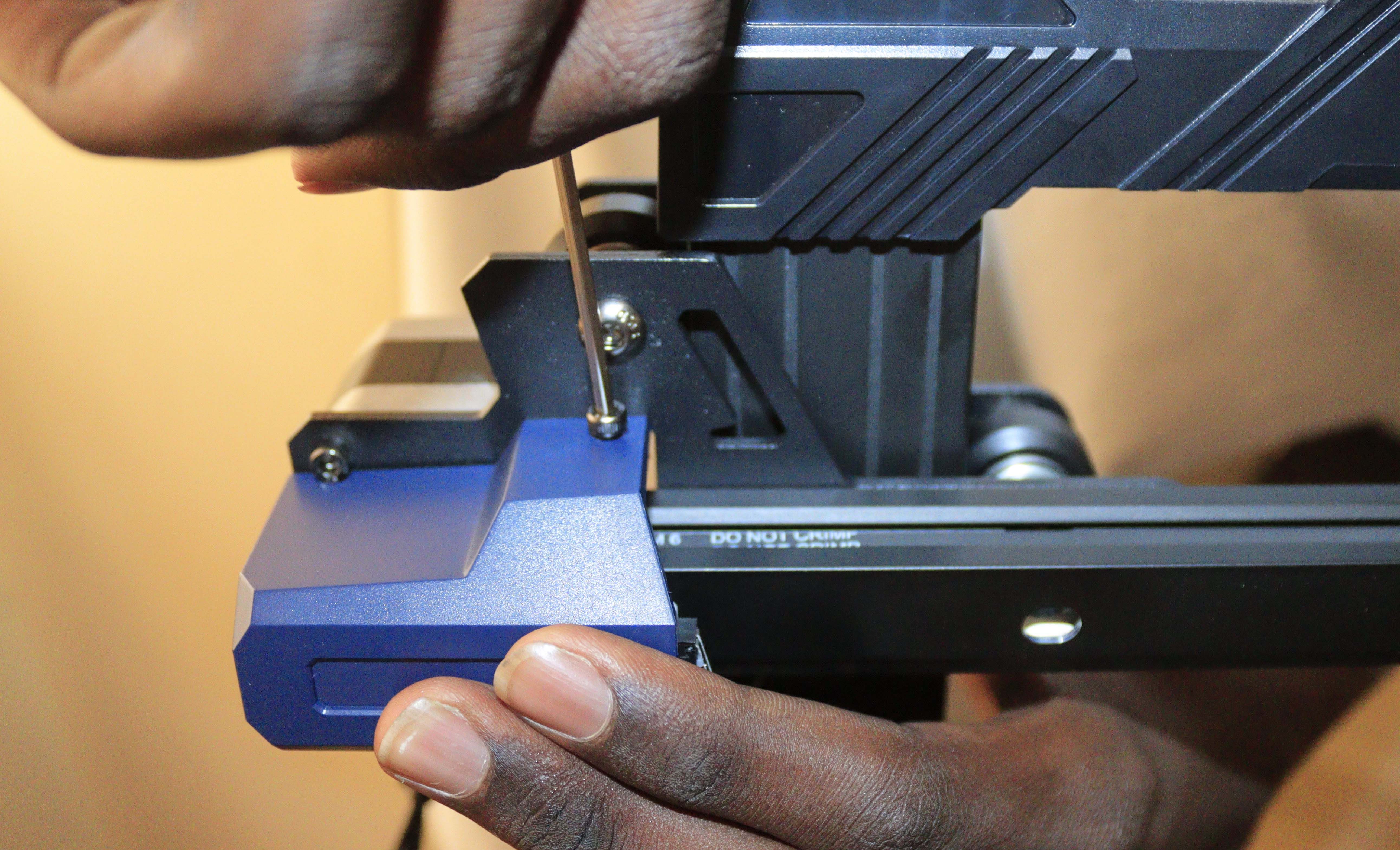 Loosening the screws on the bracket of the X-axis