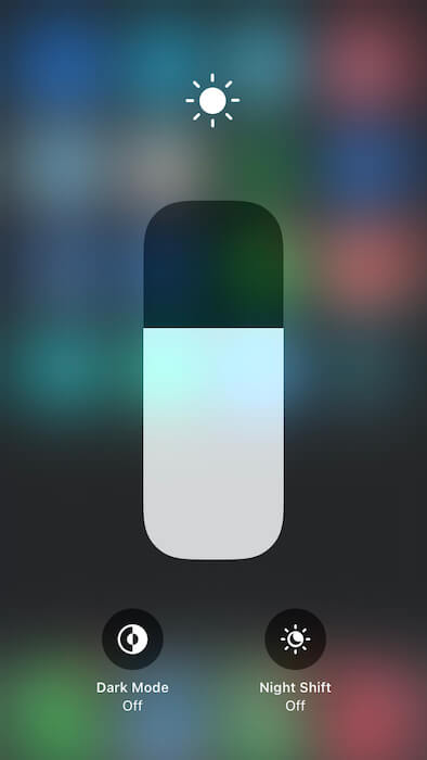 You can toggle Dark Mode, in iOS' Control Panel.