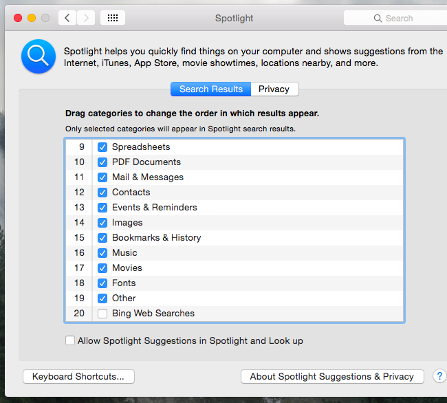 Окно настроек Spotlight на Mac с параметрами подсказок и Bing