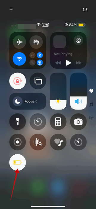 New Low Power Mode toggle visible in Control Center on iPhone. 