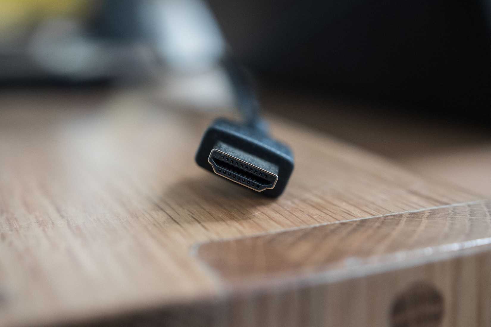 An HDMI connector on a wooden table