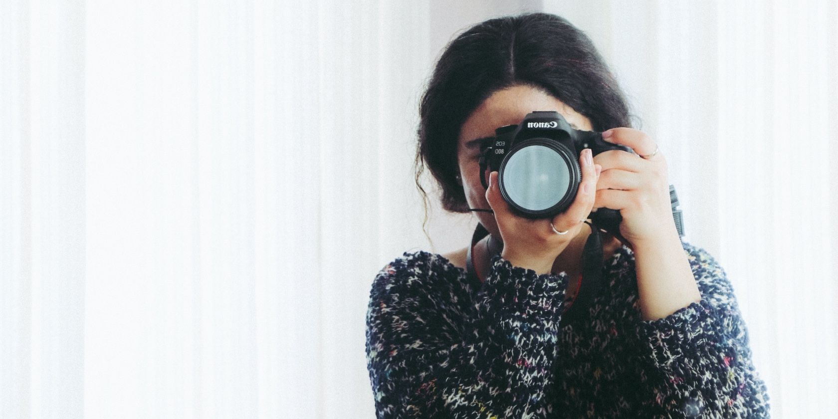 Photo of a photographer with a camera