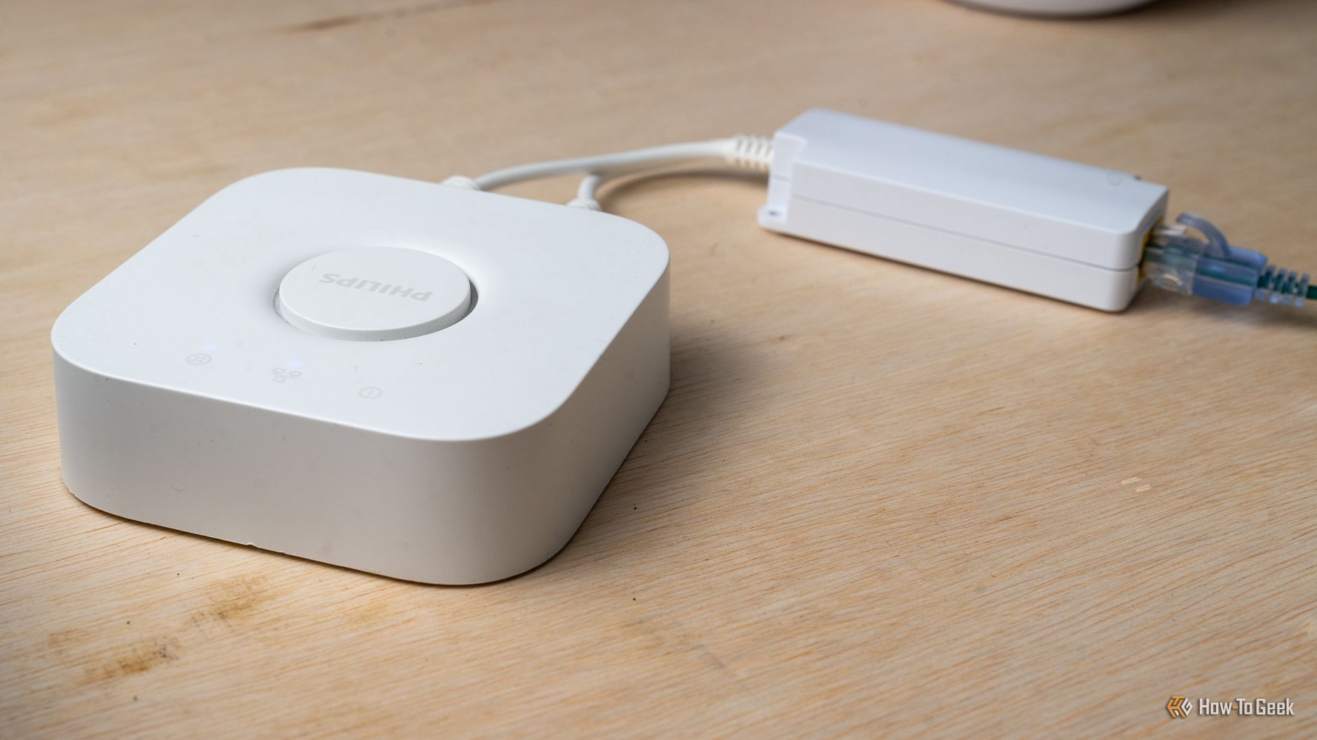 A Power over Ethernet splitter plugged into a Hue Hub V2.