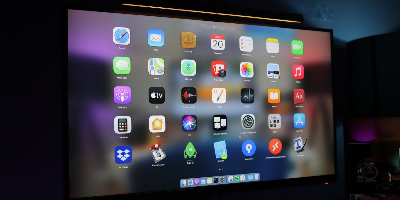 A computer monitor showing several apps.