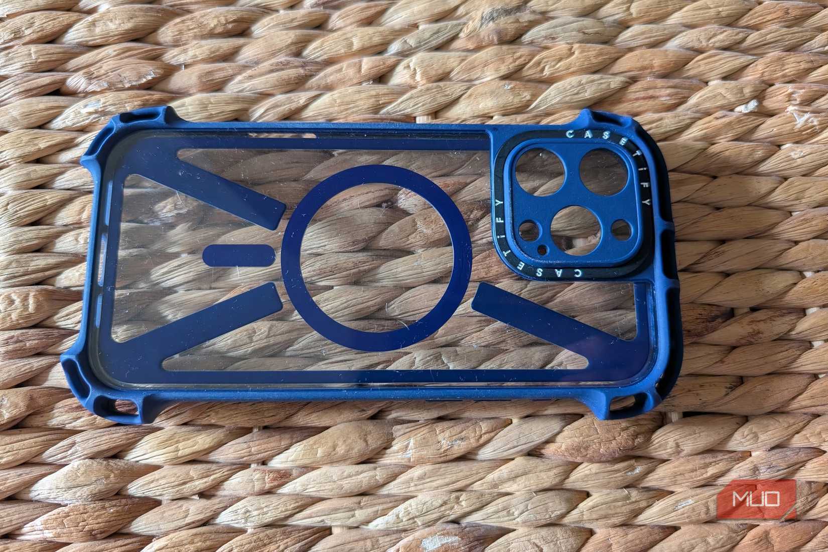A clear iPhone case on a rugged surface