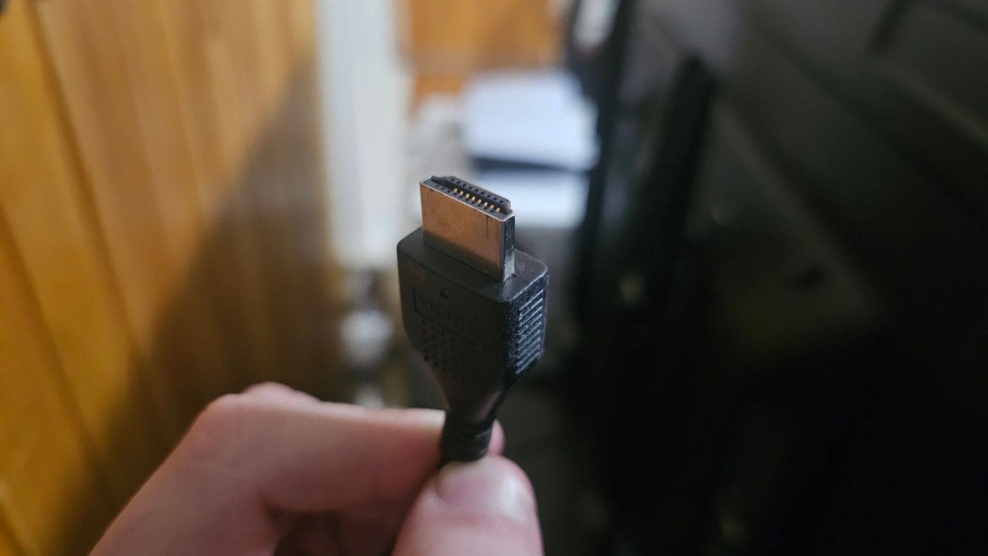 A close-up of a dirty HDMI cable.