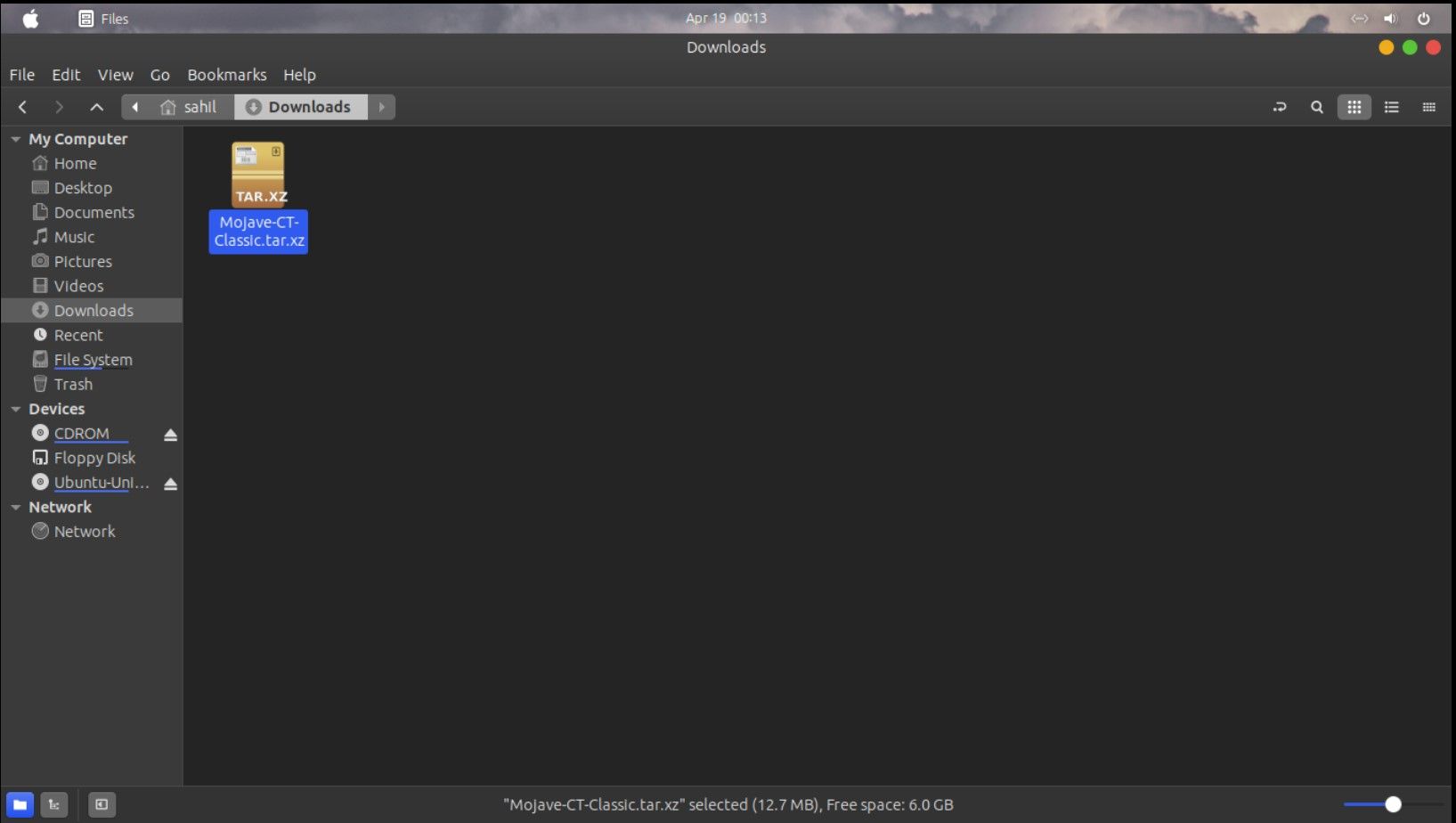 Папка Загрузки в Ubuntu 23.04 с файлом Mojave-CT-Classic.tar.xz