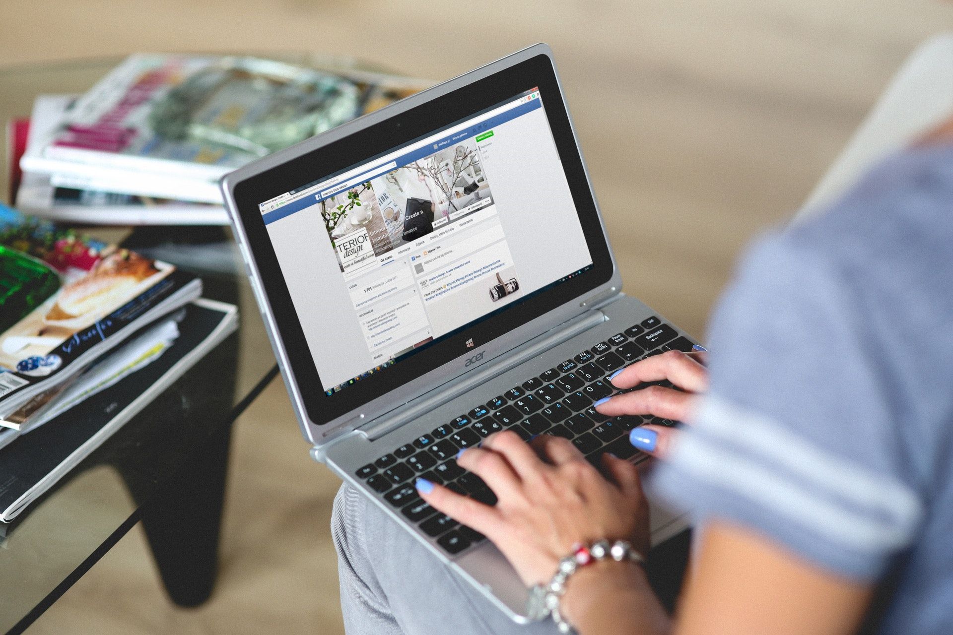 Women Working on Facebook on a Laptop