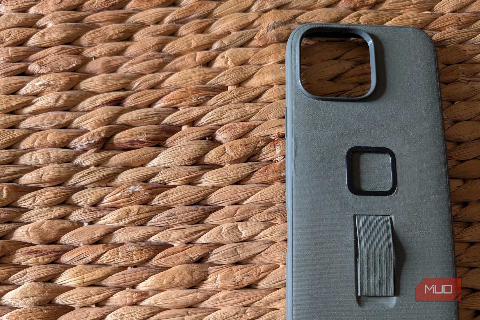 A specialty iPhone case on a rugged surface