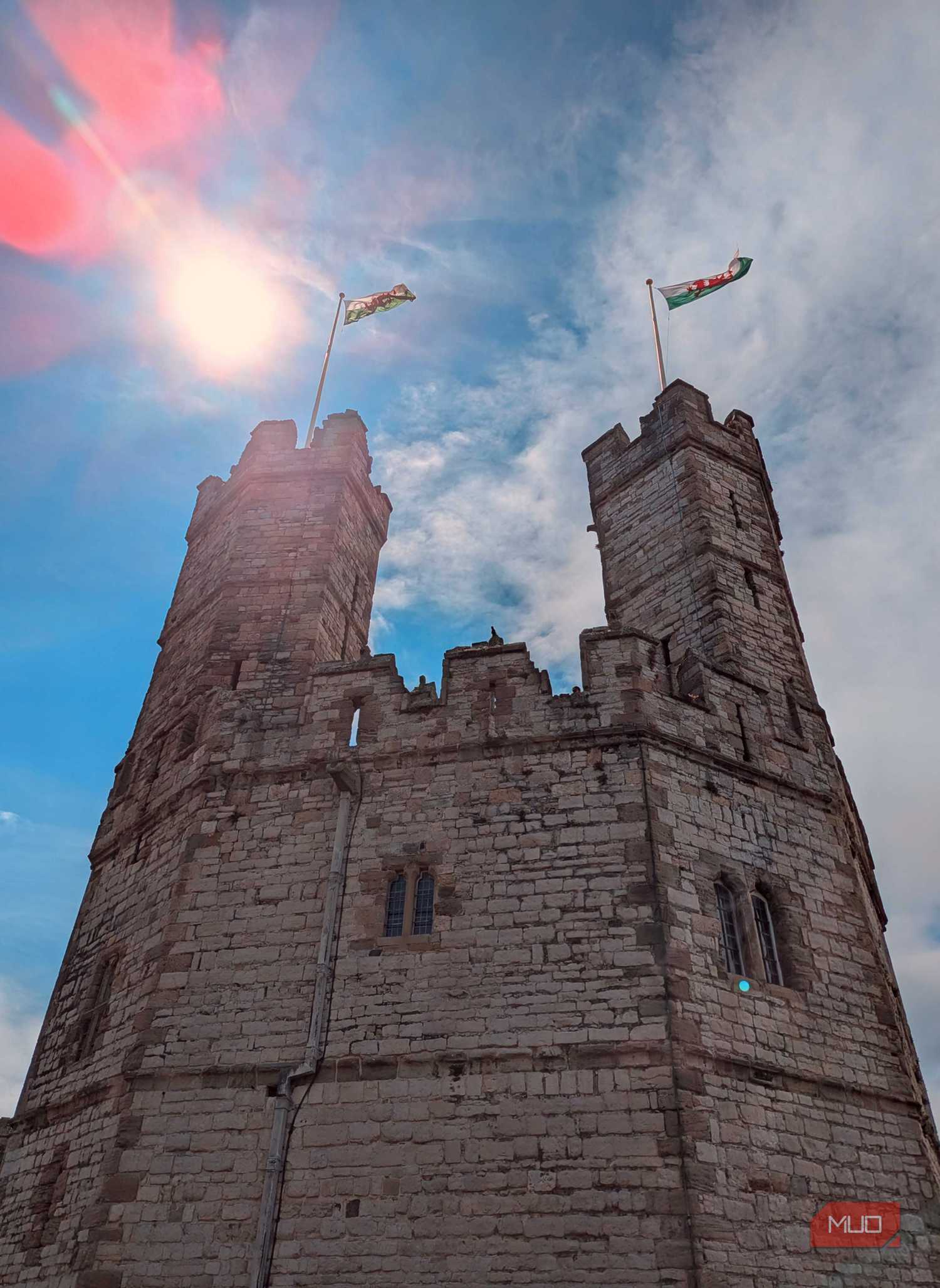 A low-angle shot of a Welsh castle