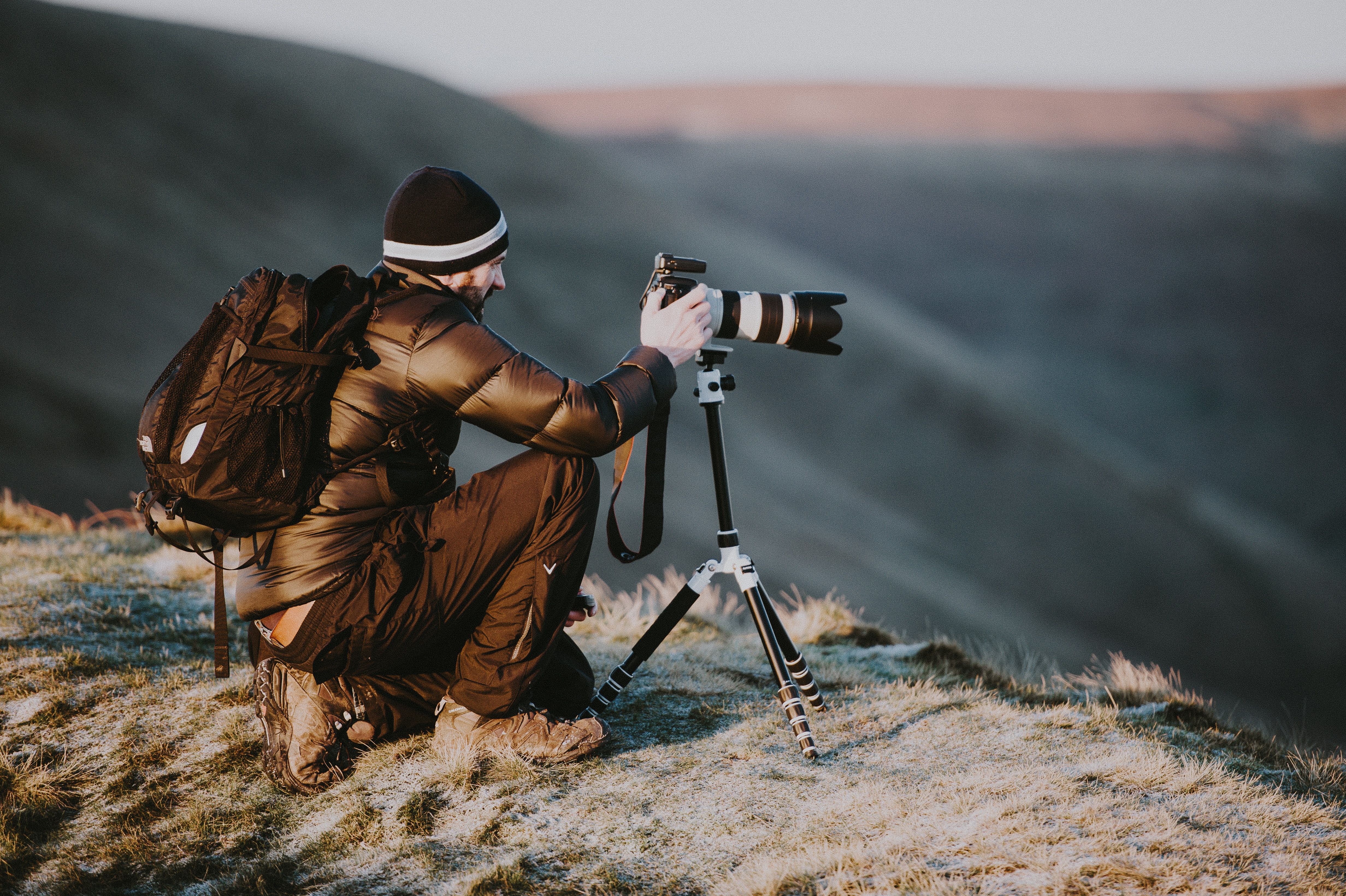 Photo of a person taking pictures with a tripod