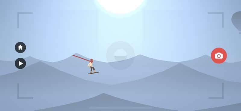 Интерфейс режима Zen в Alto’s Odyssey с кнопкой камеры для съёмки кадров