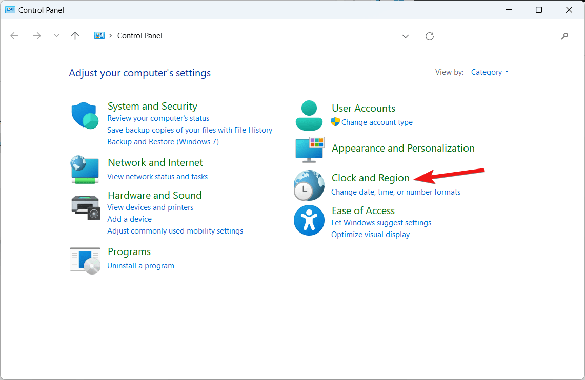 Выберите Часы и регион