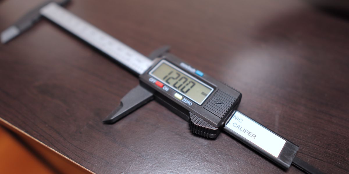 Vernier caliper set at 120 mm for measuring filament
