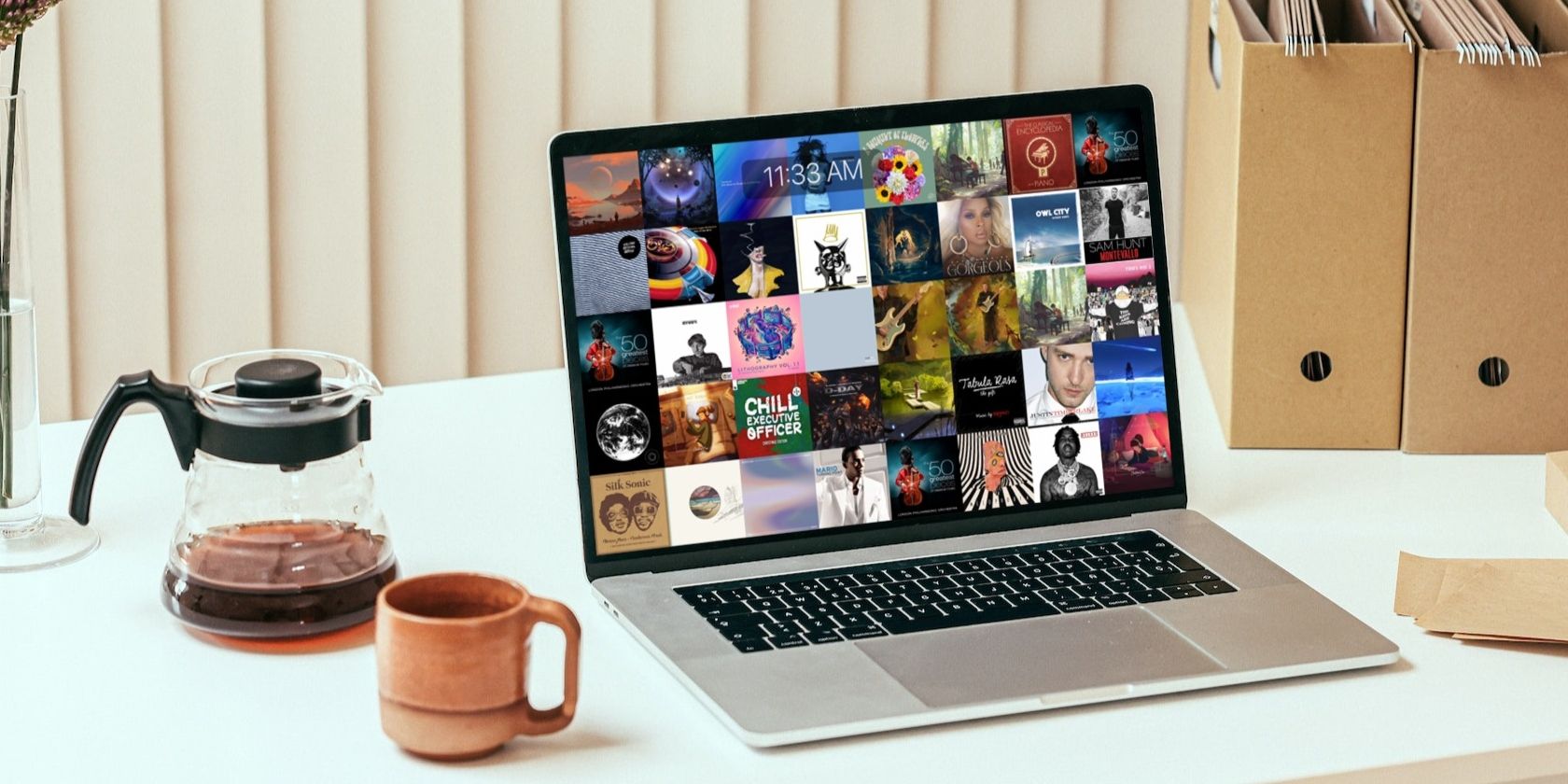 Заставка с обложками альбомов на Mac