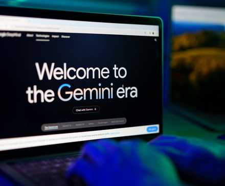 Welcome to the Gemini Era Text on a Laptop