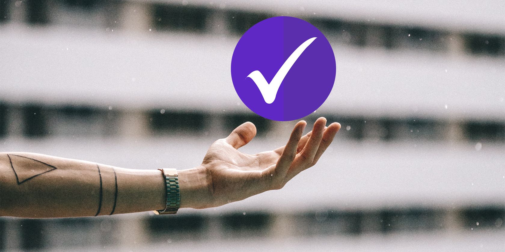 Hand holding a checkmark