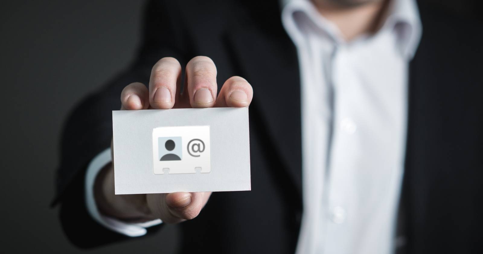 Person Holding a Business card with vCard Logo