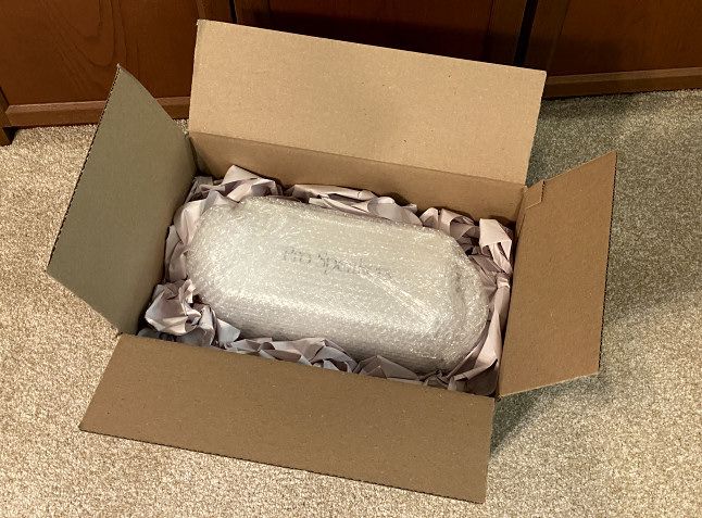 Crumple newsprint and use it to fill the empty spaces between the item and the box on all sides.