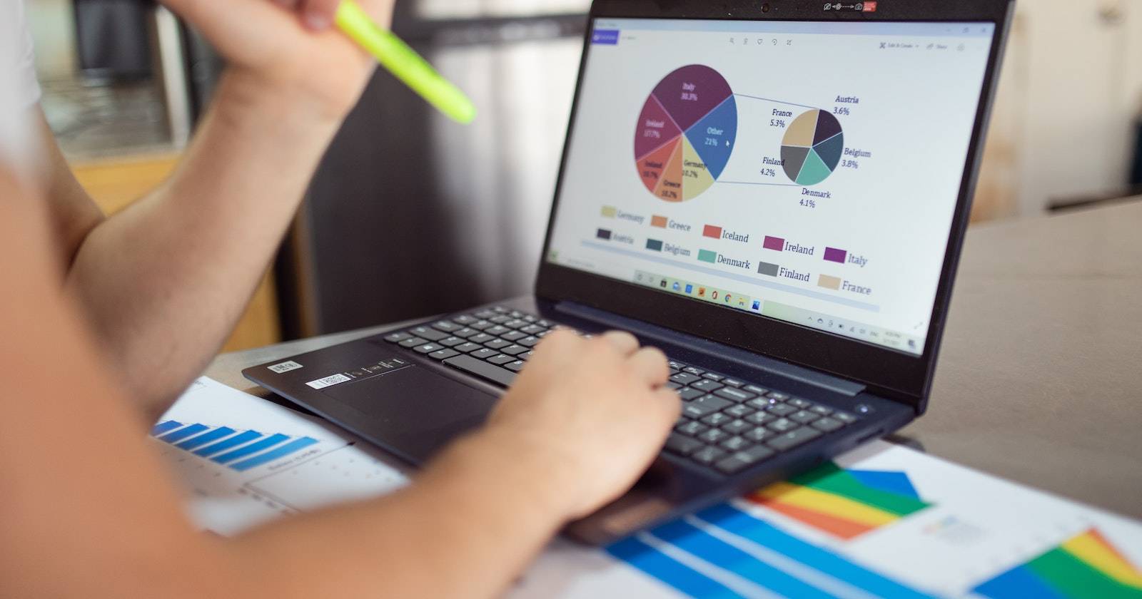 A person using laptop and looking at data