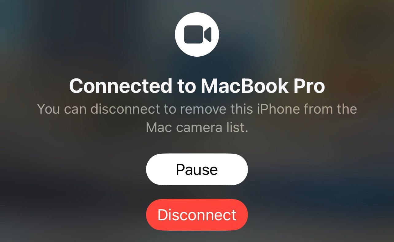 Экран iPhone с уведомлением о подключении Continuity Camera и опциями паузы/отключения