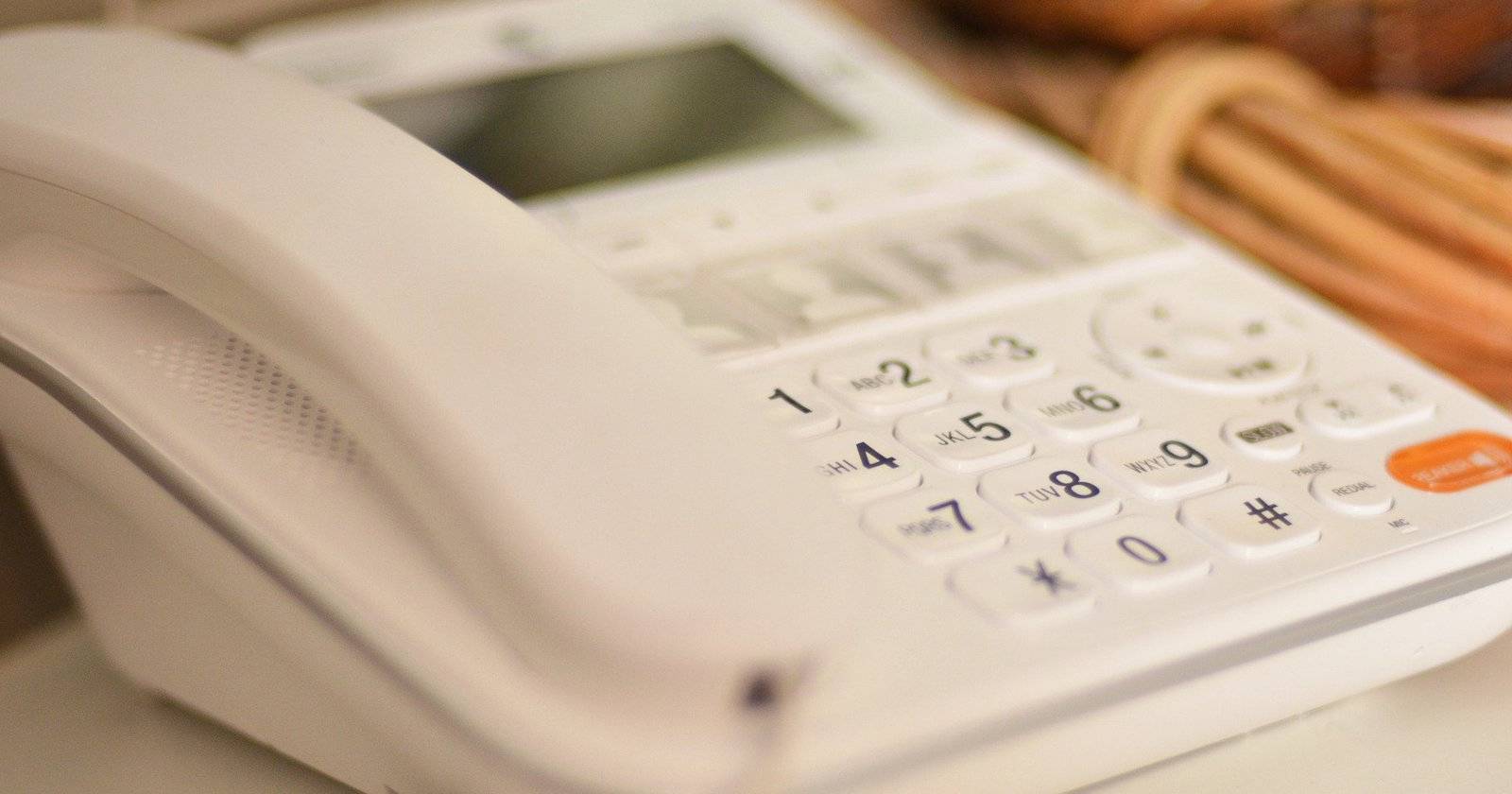 white landline phone