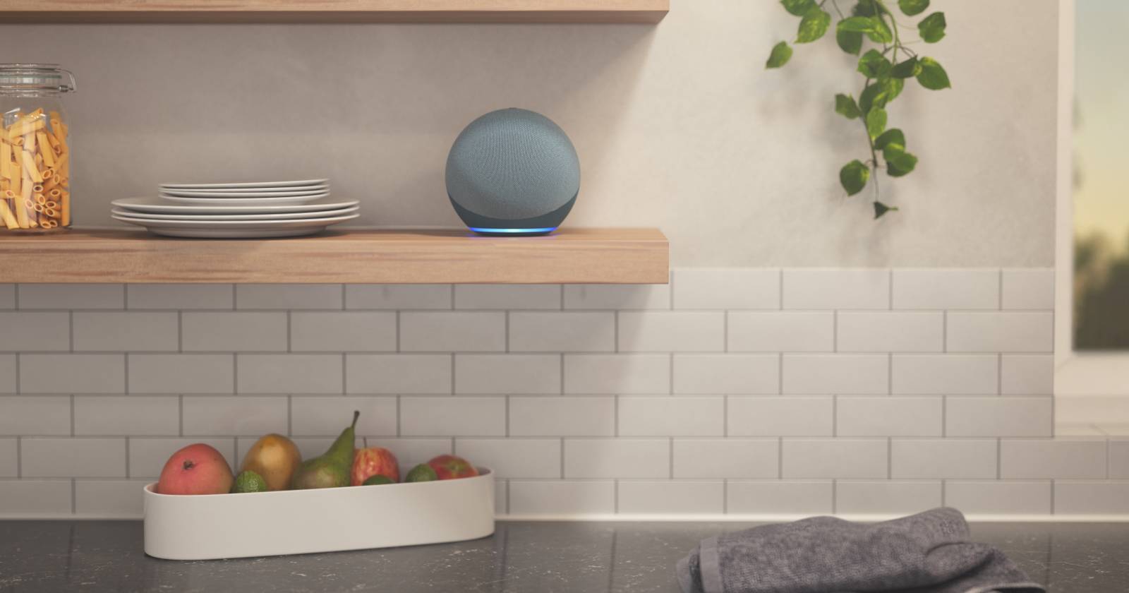 An Amazon Echo sat on a shelf in a kitchen