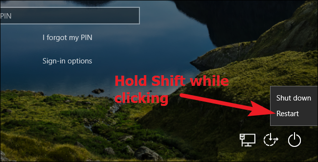 Удерживать Shift и нажать Перезагрузка на экране входа Windows 10