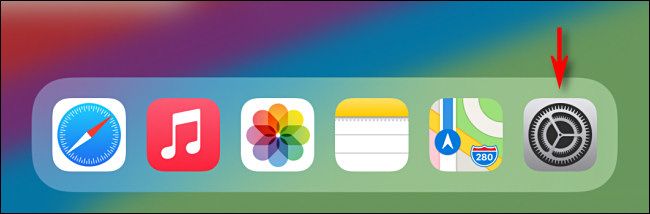 Нажмите серый значок приложения Настройки на iPad