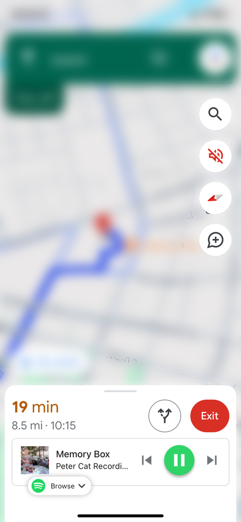 Google Maps on iOS with Spotify playback controls at the bottom of the navigation window