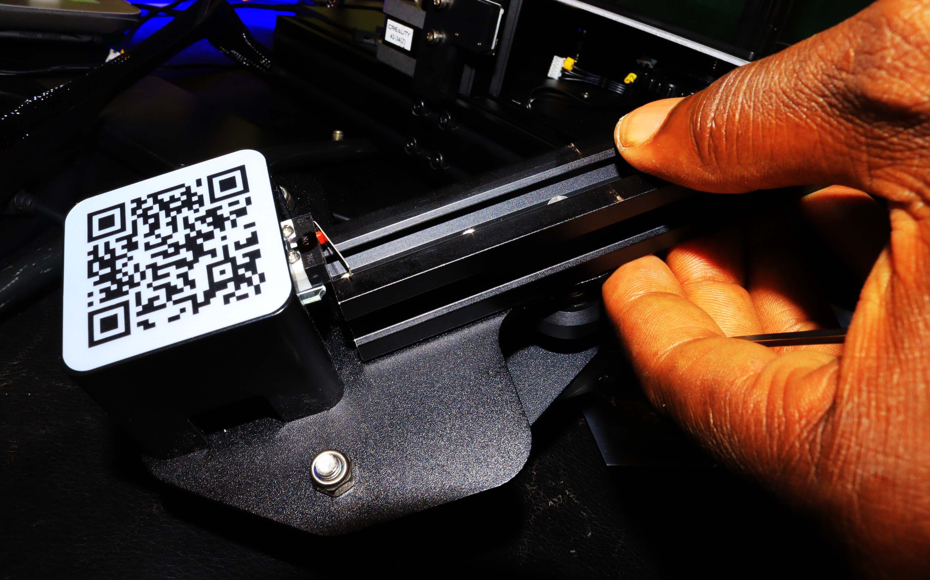 A hand inserting the timing belt into the XE shaft 