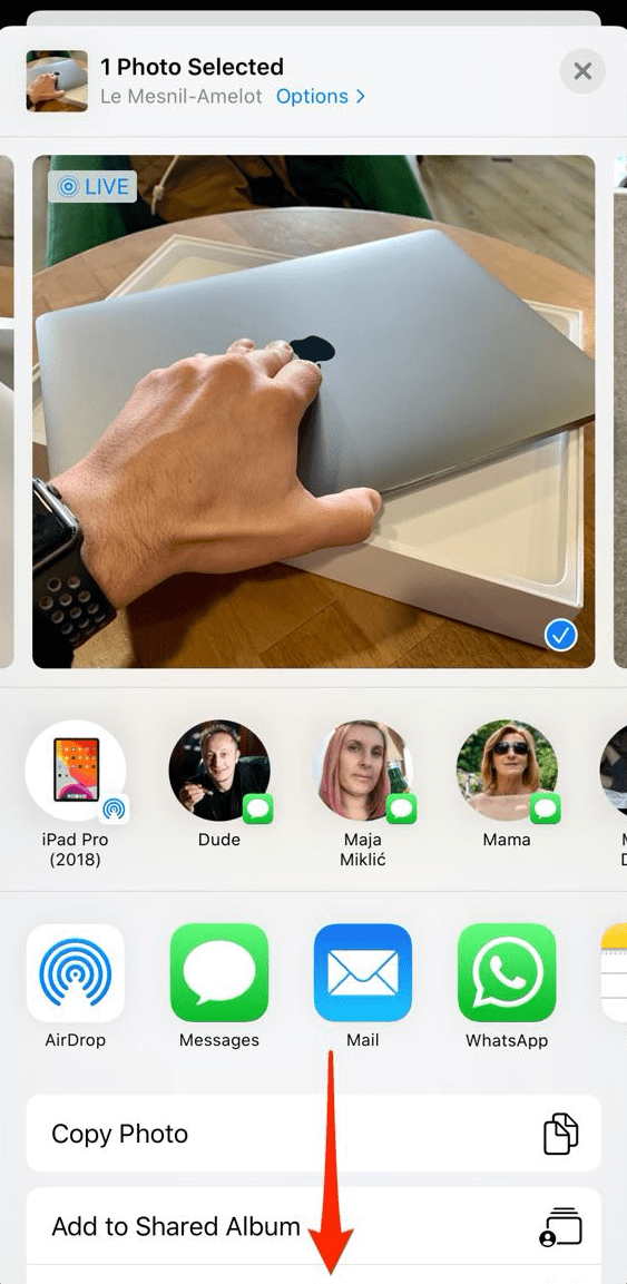 Bouton de partage dans l'app Photos sur iPhone