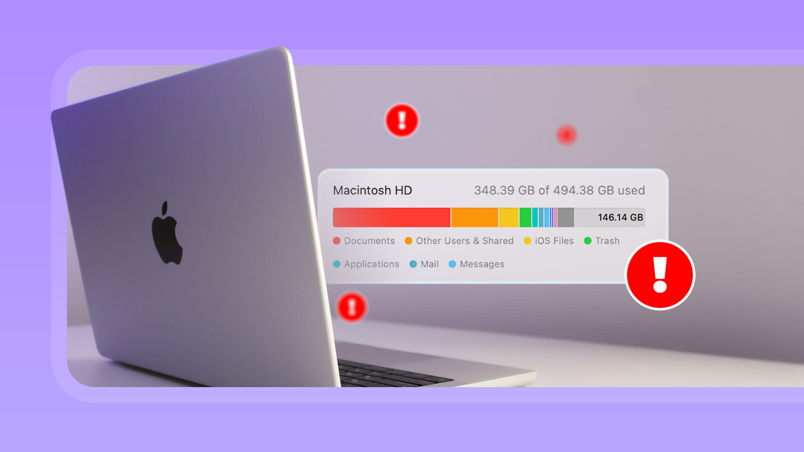 Ноутбук MacBook на столе: индикатор хранилища macOS показывает почти полный диск Macintosh HD, отмечен красными иконками предупреждения.