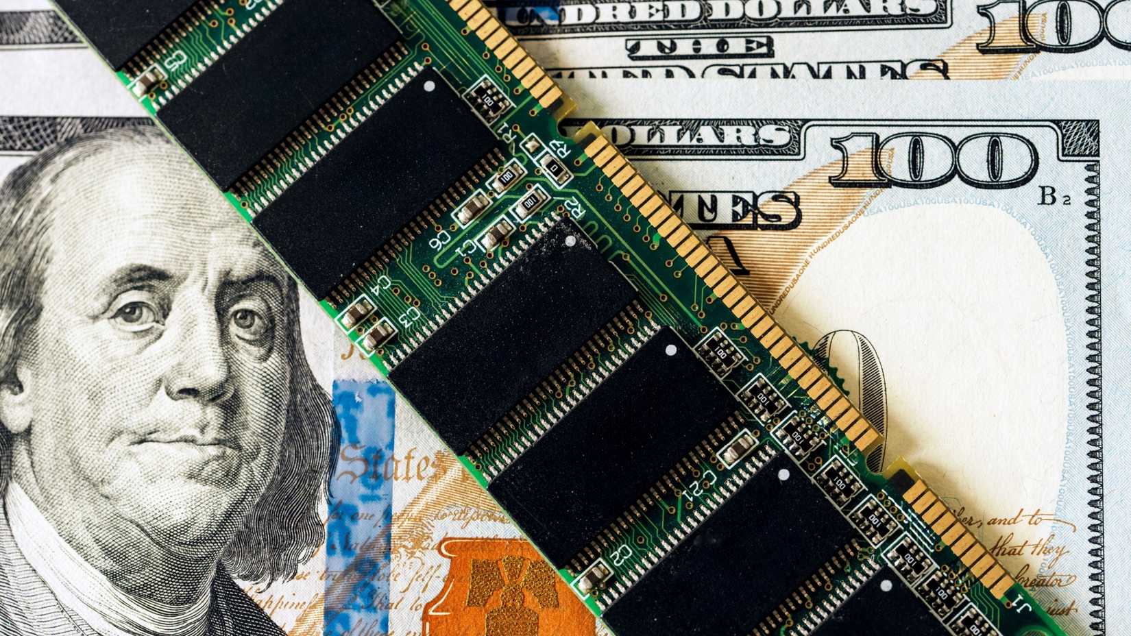 Close-up of RAM module on U.S. dollar bills: highlighting the cost of technology components.