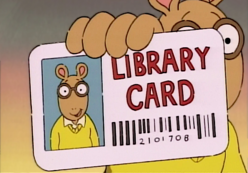 Pessoa segurando um cartão de biblioteca.