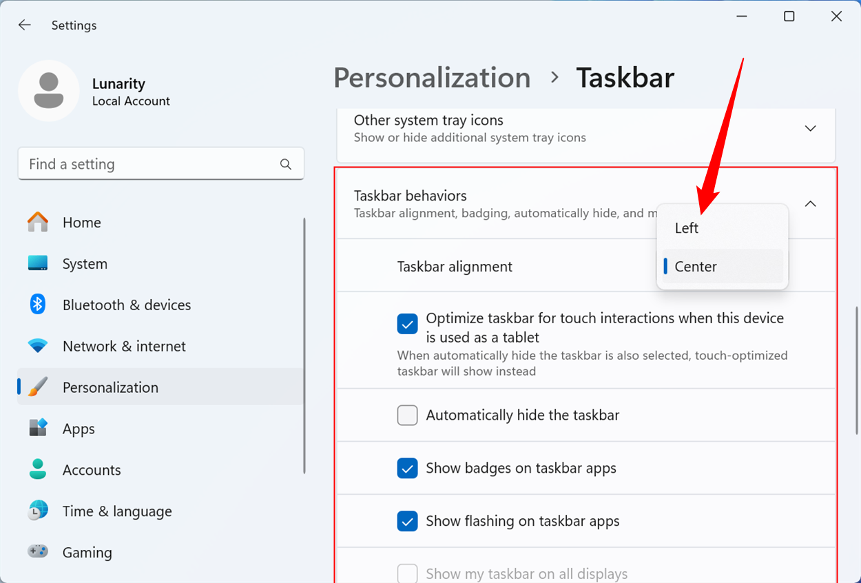 Выпадающее меню для выбора выравнивания панели задач: «Слева» или «По центру»