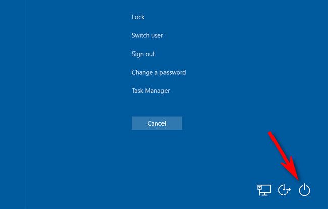 На экране Ctrl+Alt+Delete нажмите значок питания внизу экрана.