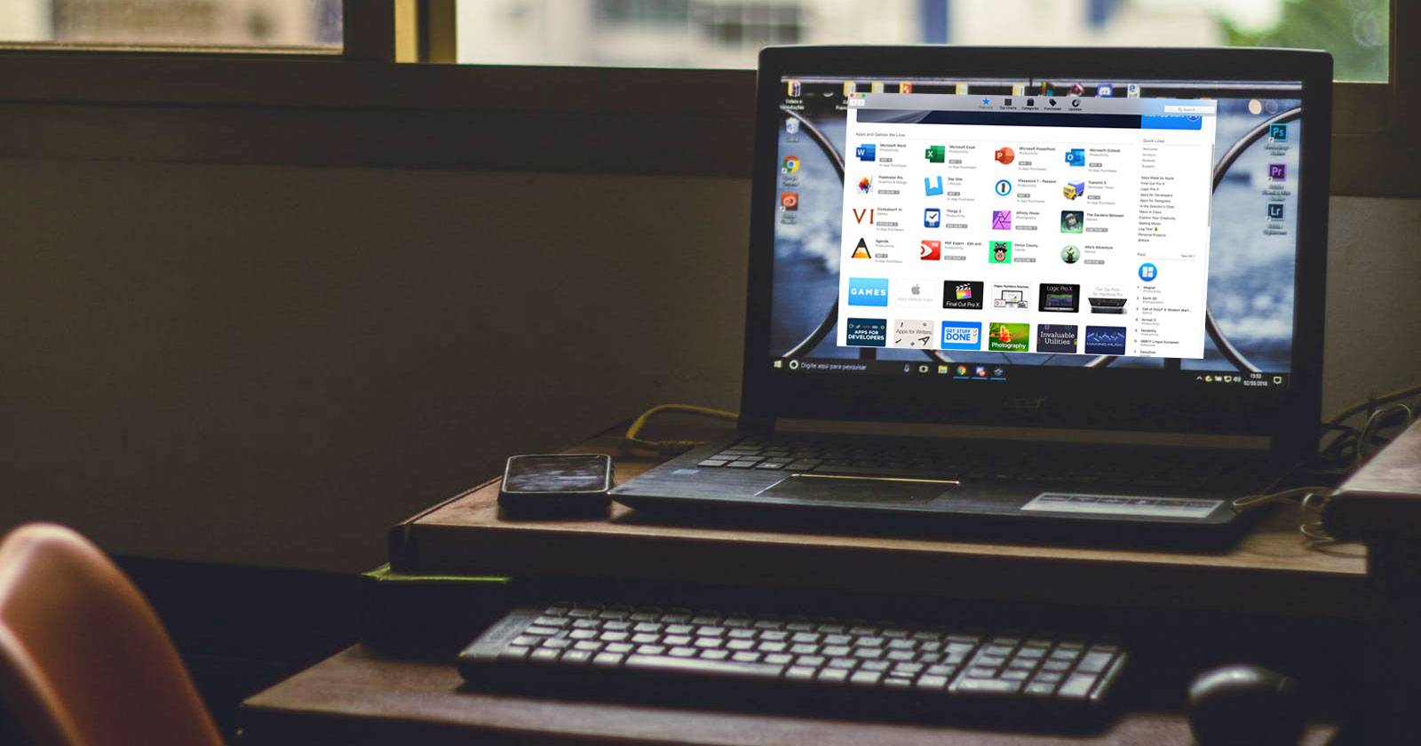 Ноутбук с Windows и значками macOS на экране