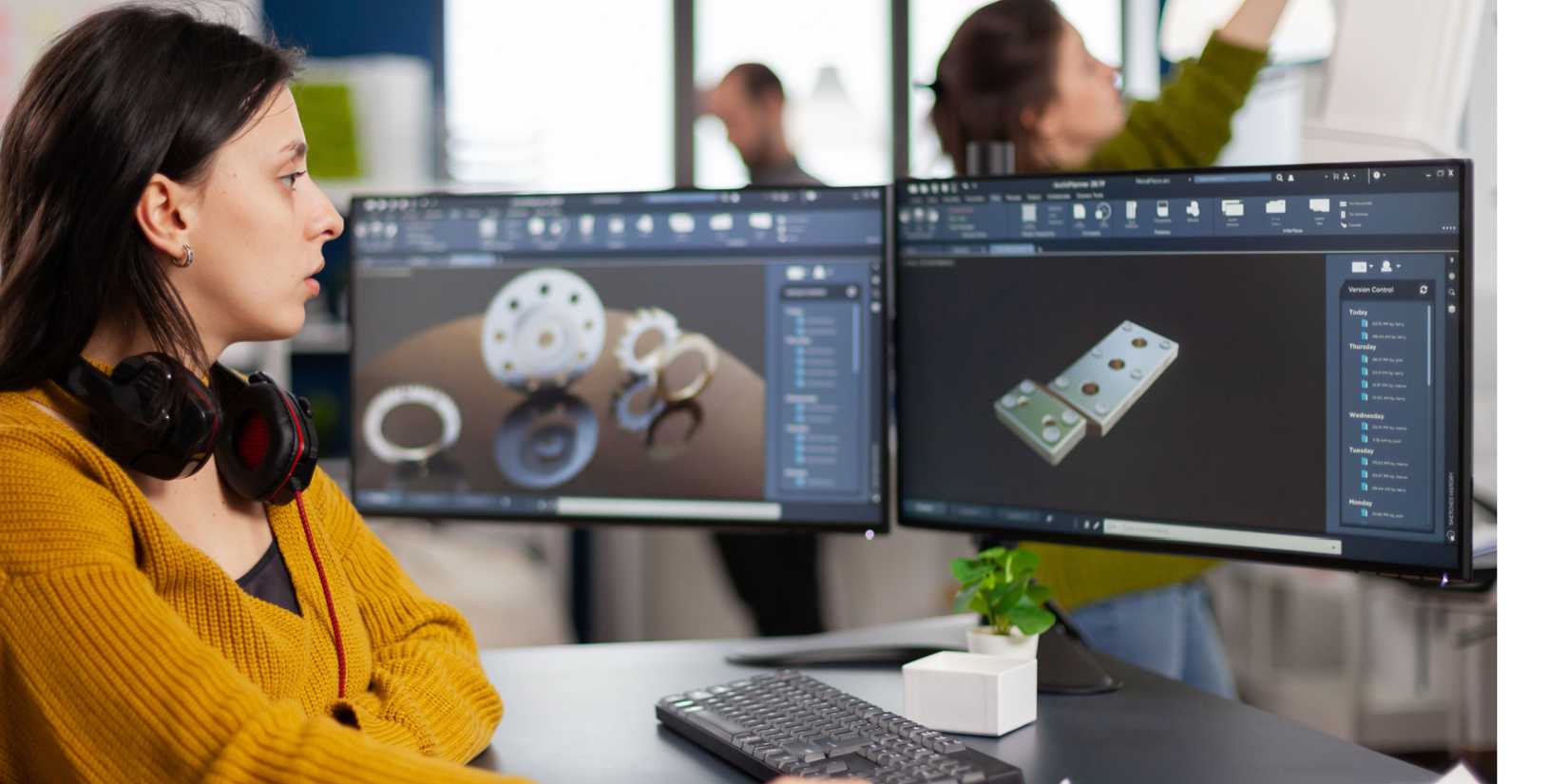 Woman using PC with two monitors