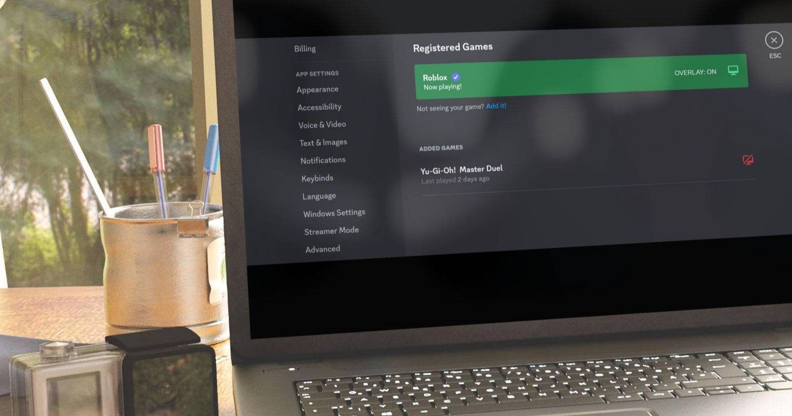 discord open on a laptop showing overlay feature turned on for Roblox Game