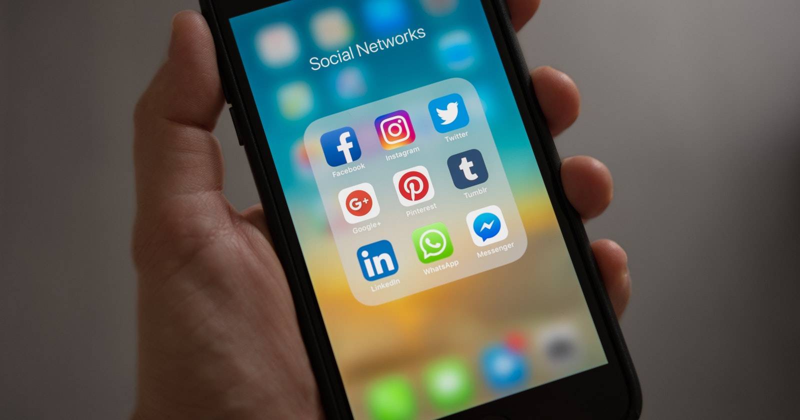 iPhone app folder showing social media apps.