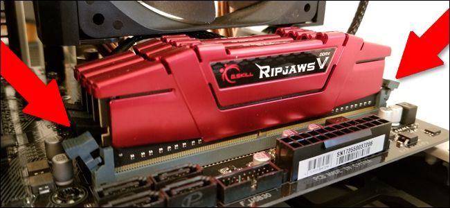 Open the tabs before you insert the RAM. 