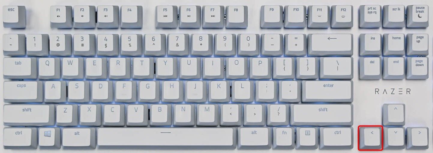 Клавиша стрелка влево выделена на клавиатуре.