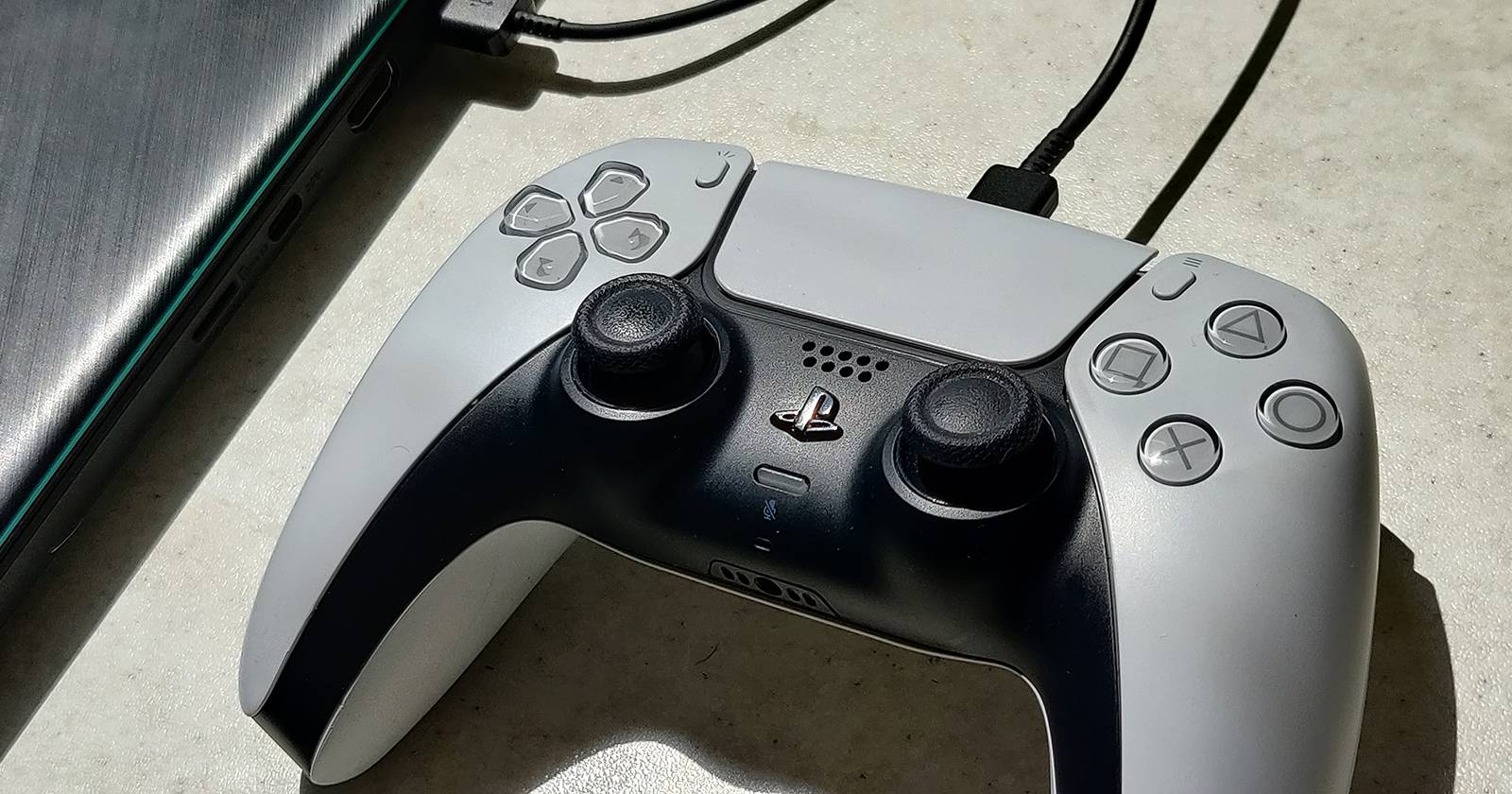 PS5 controller connected with USB wire