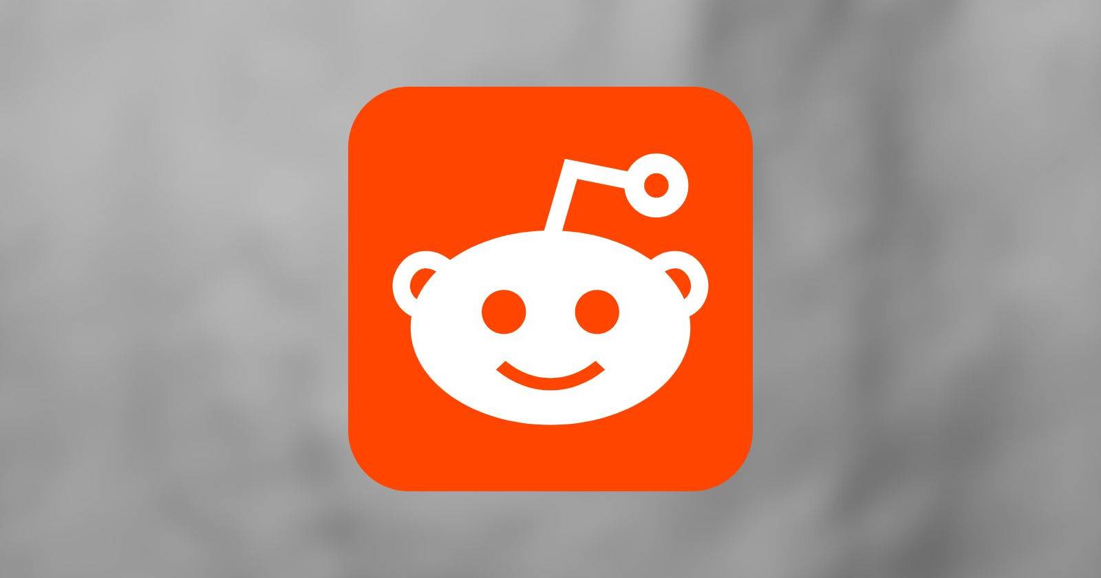 Логотип Reddit на сером фоне